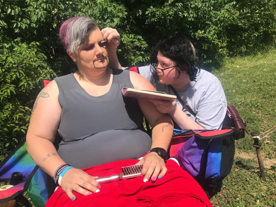 Victoria Potridge applies makeup to Fremont Pride Festival pageant contestant Ryder Gently Saturday at the festival. Gently, 39, of Tiffin, participated in the Mr. Fremont Pride pageant.