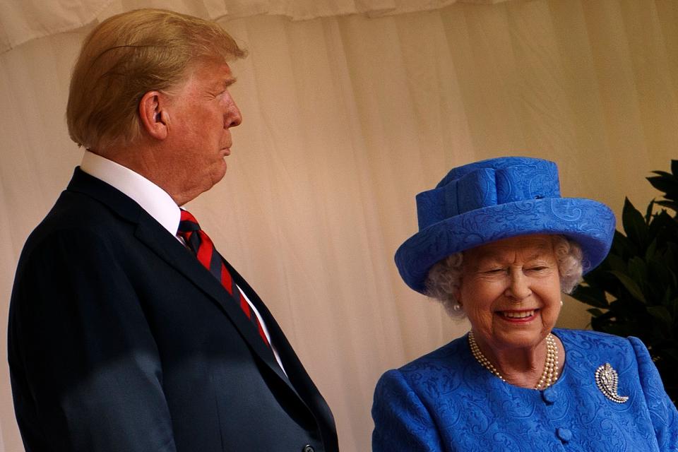 US President Donald Trump speaks with Britain's Queen Elizabeth II after he inspected the Guard of Honour at Windsor Castle in Windsor, west of London, on July 13, 2018 on the second day of Trump's UK visit. - US President Donald Trump on Friday played down his extraordinary attack on Britain's plans for Brexit, praising Prime Minister Theresa May and insisting bilateral relations "have never been stronger", even as tens of thousands protested in London against his visit. (Photo by Brendan Smialowski / AFP)        (Photo credit should read BRENDAN SMIALOWSKI/AFP/Getty Images)