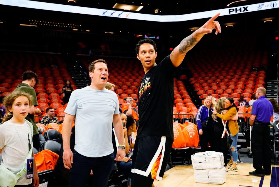 Phoenix Mercury owner Mat Ishbia talks to center Brittney Griner during the home opener against the Chicago Sky at Footprint Center in Phoenix on May 21, 2023.