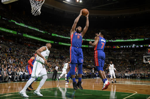 Andre Drummond pulls down a rebound against the Celtics on Monday night. (Getty Images)