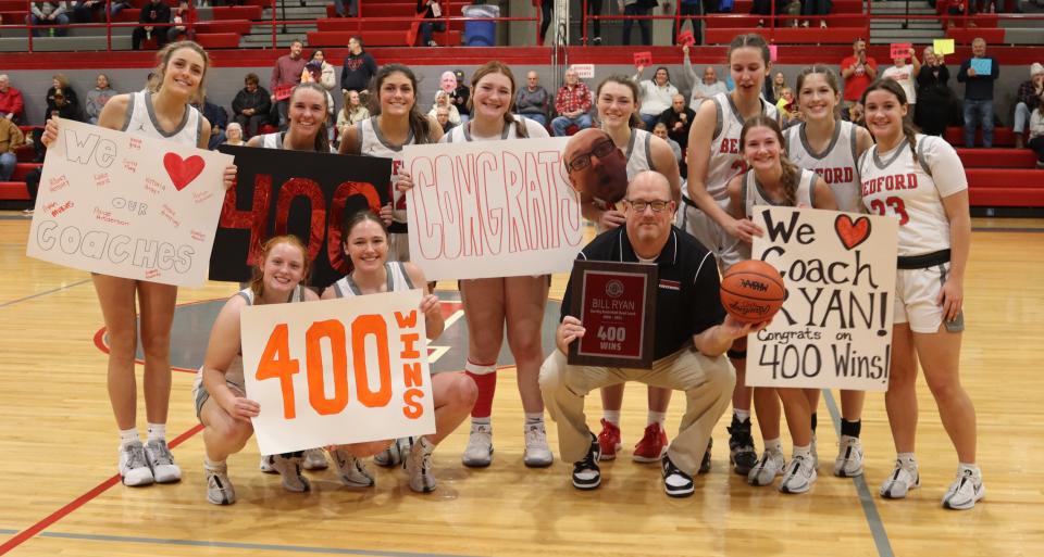 Bedford's girls basketball team helps coach Bill Ryan celebrate his 400th career victory.