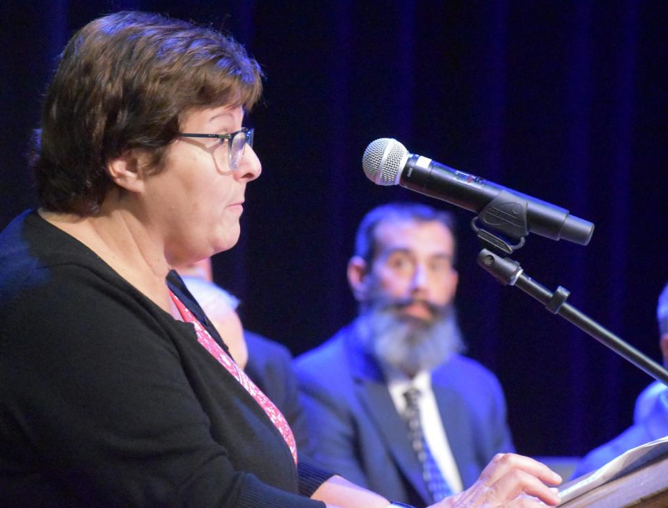 Fall River Superintendent of Schools Maria Pontes speaks at Durfee's dedication Thursday as Durfee principal Matt Desmarais listens to her.