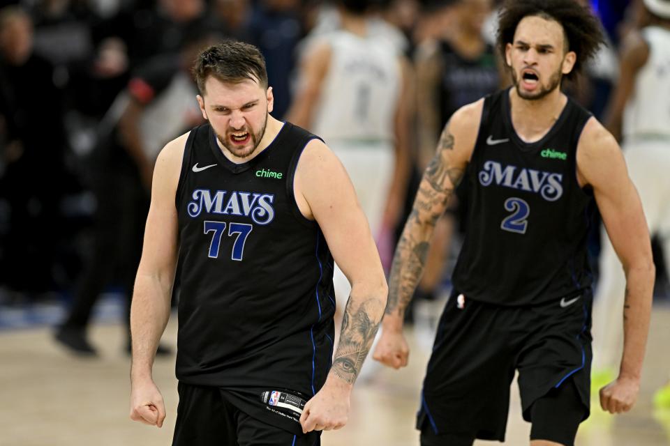 MINNEAPOLIS, MINNESOTA - MAY 24: Luka Doncic #77 and Dereck Lively II #2 of the Dallas Mavericks celebrate after defeating the Minnesota Timberwolves in Game Two of the Western Conference Finals at Target Center on May 24, 2024 in Minneapolis, Minnesota. (Photo by Stephen Maturen/Getty Images)