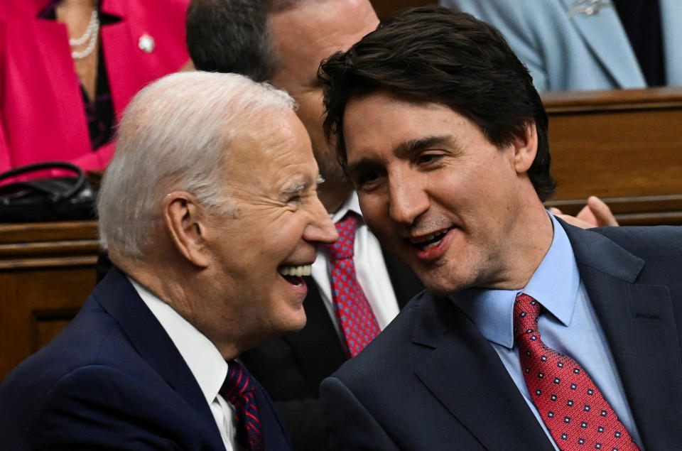 U.S. President Joe Biden and Canadian Prime Minister Justin Trudeau speak as they attend an address to the Canadian Parliament, in Ottawa, Canada, Mach 24, 2023. Kenny Holston/Pool via REUTERS