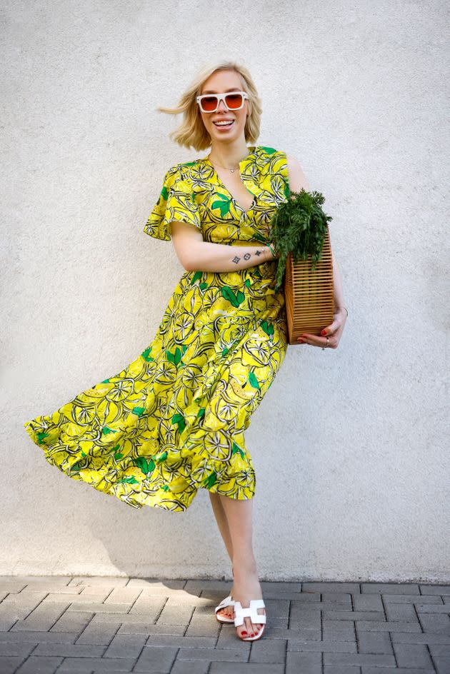 Hairstylist Svenja Simmons wearing a yellow lemon-print top and matching skirt from Diane von Furstenberg during a street style shoot in Dusseldorf, Germany, on June 4, 2021. (Photo: Streetstyleshooters via Getty Images)