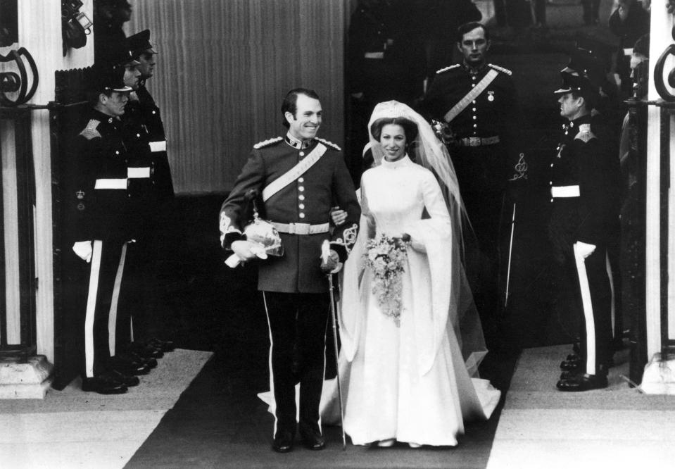 Princess Anne wore a high-neck dress by Maureen Baker to wed Mark Phillips in November 1973. (Getty Images) 