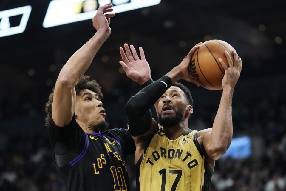 Toronto Raptors forward Garrett Temple (17) drives as Los Angeles Lakers centre Jaxson Hayes (11) defends during the first half of an NBA basketball game Tuesday, April 2, 2024, in Toronto. (Frank Gunn/The Canadian Press via AP)