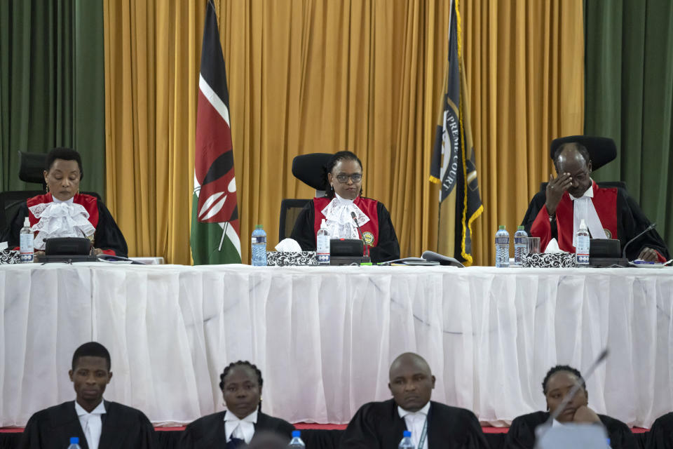 From left to right, Kenya's Supreme Court judges Deputy Chief Justice Philomena Mbete Mwilu, Chief Justice Martha Koome, and Mohammed Khadhar Ibrahim, deliver judgement in the electoral petition at the Supreme Court in Nairobi, Kenya, Monday, Sept. 5, 2022. Kenya's Supreme Court on Monday is ruling on challenges to the presidential election in which Deputy President William Ruto was declared the winner by a slim margin and opposition candidate Raila Odinga alleged irregularities in the otherwise peaceful Aug. 9 election. (AP Photo/Ben Curtis)