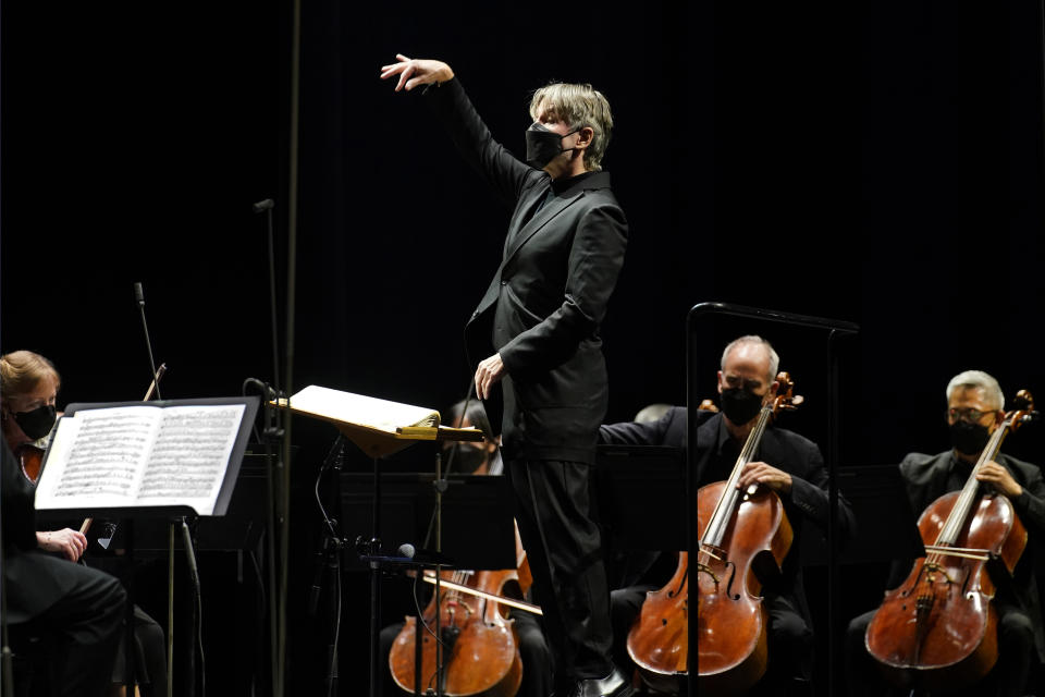 CORRECTS SPELLING OF FIRST NAME TO ESA INSTEAD OF ESSA - Guest conductor Esa-Pekka Salonen, music director of the San Francisco Symphony and principal conductor of London's Philharmonia Orchestra, leads the New York Philharmonic as the orchestra perform together before a live audience of 150 people for the first time since March 10, 2020, at The Shed in Hudson Yards, Wednesday, April 14, 2021, in New York. (AP Photo/Kathy Willens)