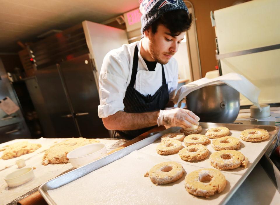 Assistant Pastry Chef Daylan Torres prepares old-fashioned apple cider donuts at Confectionary Designs in Rehoboth on Thursday, Oct. 13, 2022.