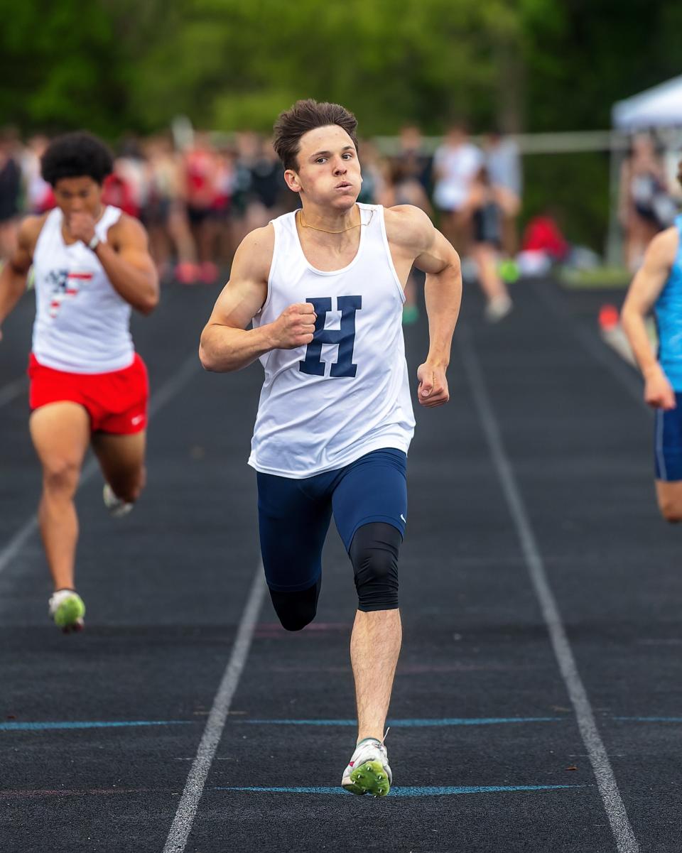 Hartland's Cameron Cheetam runs a meet-record time of 21.83 seconds during the KLAA track and field championships Saturday, May 11, 2024 at Howell High School.