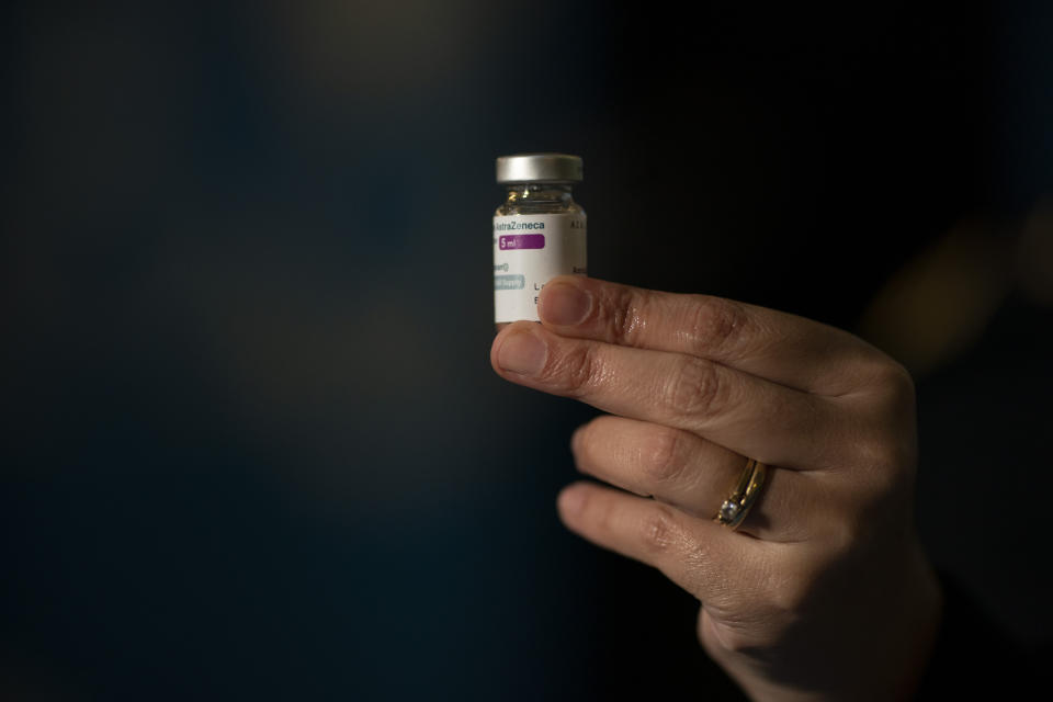 A nurse holds a dose of the AstraZeneca vaccine at the Nestor Kirchner Cultural Center, the largest cultural center in Latin America, where security forces are being vaccinated in Buenos Aires, Tuesday, June 15, 2021. Argentina is speeding up its vaccination process amid a severe second COVID-19 wave. (AP Photo/Victor R. Caivano)
