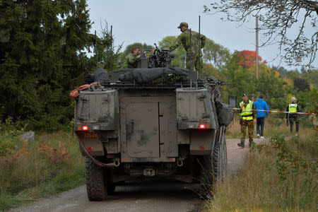 A passenger train collided with a tank and derailed, where the Swedish Military exercise Aurora 17 is taking place, near Trosa, south of Stockholm, Sweden, September 26, 2017. TT News Agency via REUTERS ATTENTION EDITORS - THIS IMAGE WAS PROVIDED BY A THIRD PARTY. SWEDEN OUT. NO COMMERCIAL OR EDITORIAL SALES IN SWEDEN. NO COMMERCIAL SALES.