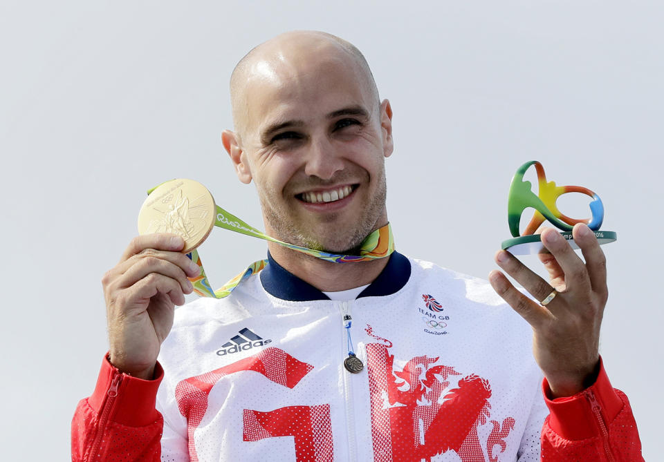 <p>Britain’s Liam Heath celebrates his gold medal in the men’s kayak single 200m final during the 2016 Summer Olympics in Rio de Janeiro, Brazil, Saturday, Aug. 20, 2016. (AP Photo/Matt York) </p>