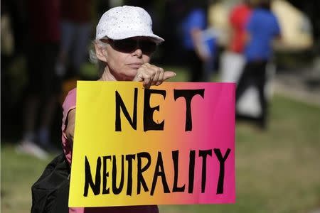 Lori Erlendsson attends a pro-net neutrality Internet activist rally in the neighborhood where U.S. President Barack Obama attended a fundraiser in Los Angeles, California, U.S. July 23, 2014. REUTERS/Jonathan Alcorn/File Photo