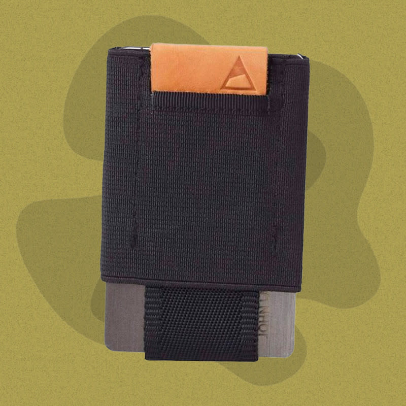 <p>Courtesy of Amazon</p><p>Want to ease into a new minimalist wallet while still leaving some cash to put in it? Nomatic's synthetic webbing wallet holds up to 14 cards with a stretchy material that won't lose its shape. Give a tug on the leather pull tab and the cards slide up enough to fan them out and find the one you need. The front holds one or two cards requiring the most frequent access, like an ID, and some folded cash in a dedicated side pocket.</p><p>[$20; <a href="https://www.amazon.com/NOMATIC-Minimalist-Pocket-Wallet-Hidden/dp/B00TVBOL6S?th=1&linkCode=ll1&tag=mj-bestslimwallets-cleblanc-081023-update-20&linkId=f6374ed4aaabc8e25b824657967fa14e&language=en_US&ref_=as_li_ss_tl" rel="nofollow noopener" target="_blank" data-ylk="slk:amazon.com;elm:context_link;itc:0;sec:content-canvas" class="link ">amazon.com</a>]</p>