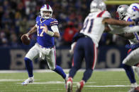 Buffalo Bills quarterback Josh Allen (17) scrambles during the second half of an NFL football game against the New England Patriots in Orchard Park, N.Y., Monday, Dec. 6, 2021. (AP Photo/Joshua Bessex)