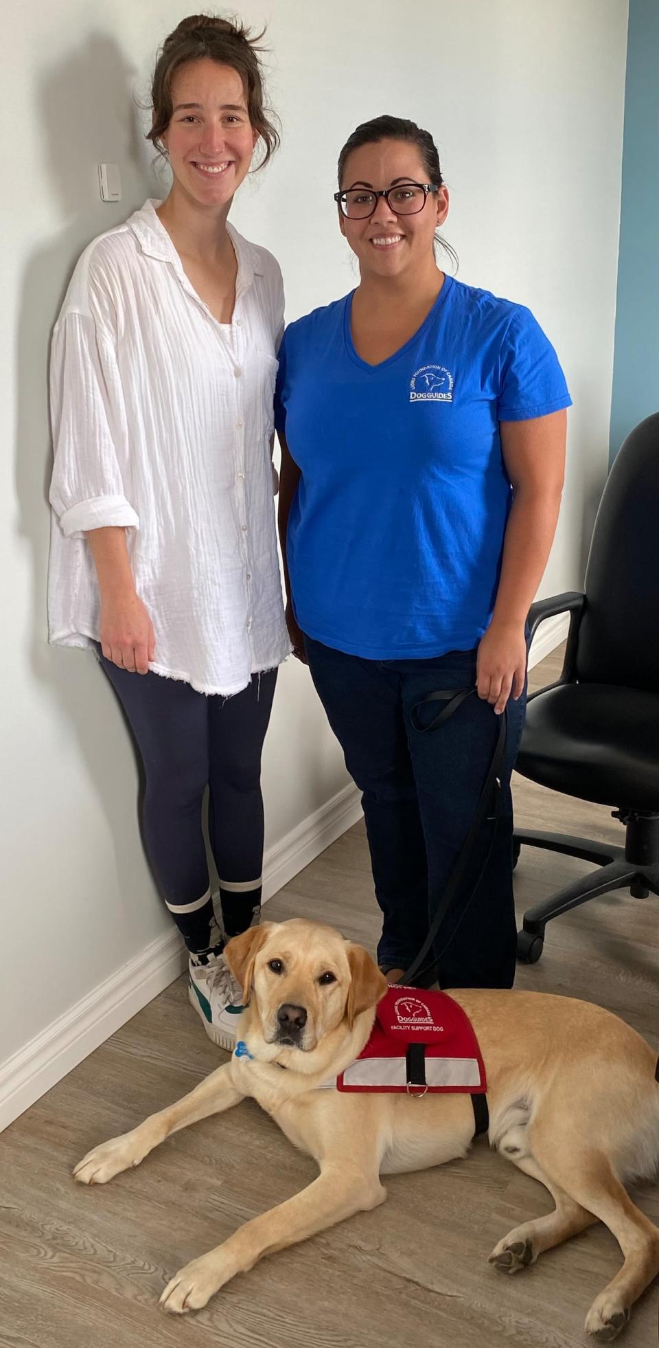 Leeside Transition House crisis counsellors Julia Smythe (left) and Kelsee Burke trained with Darwin at the Lions’ Foundation facility in Oakville, Ont., for 10 days in June, before bringing him to the Port Hawkesbury shelter. 