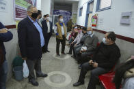 Elderly Indian wait to receive COVID-19 vaccine at the Government Medical College hospital in Jammu, India, Monday, March 1, 2021. India is expanding its COVID-19 vaccination drive beyond health care and front-line workers, offering the shots to older people and those with medical conditions that put them at risk. (AP Photo/Channi Anand)