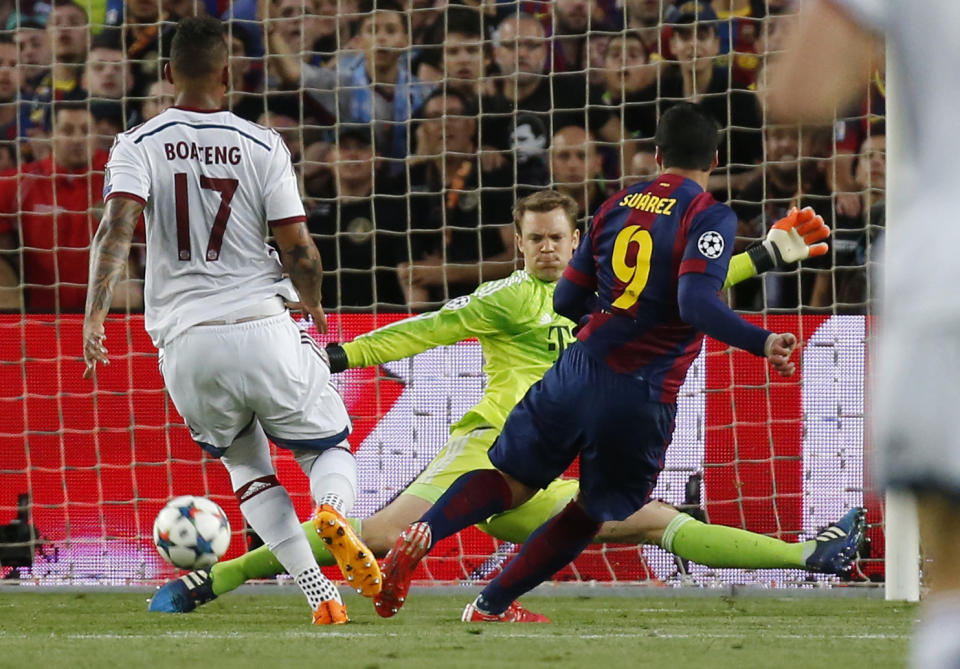 Football: Bayern Munich's Manuel Neuer saves from Barcelona's Luis Suarez