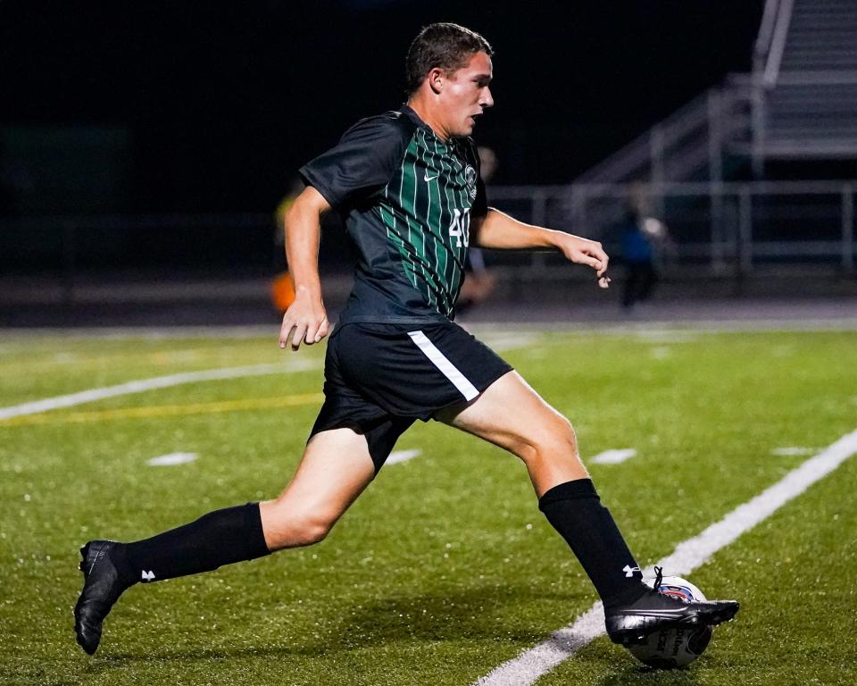 Aurora sophomore Jonah Shanholzter makes a break downfield against Roosevelt at Aurora High School on September 21, 2021.