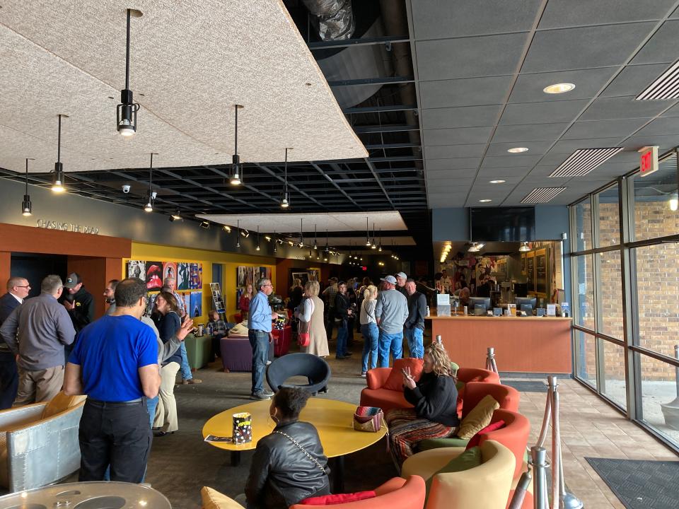 Audiences hang out in the lobby of the Fleur Cinema & Café in advance of "Chasing the Dead" in 2022, one of the private screenings held since the theater closed to the public three years ago.