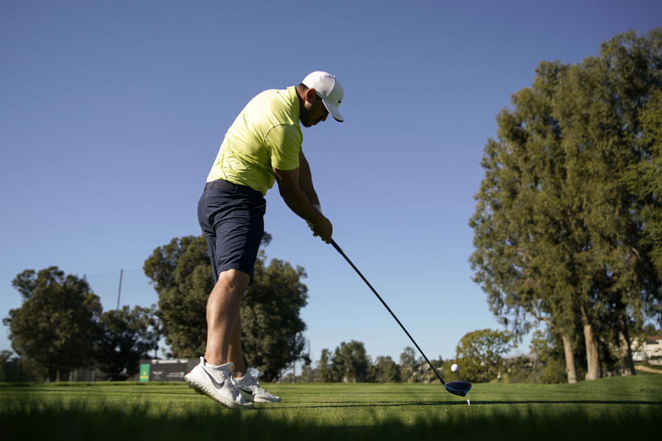 Brooks Koepka tees off on the second hole during the Genesis Invitational pro-am golf event at Riviera Country Club, Wednesday, Feb. 17, 2021, in the Pacific Palisades area of Los Angeles. (AP Photo/Ryan Kang)