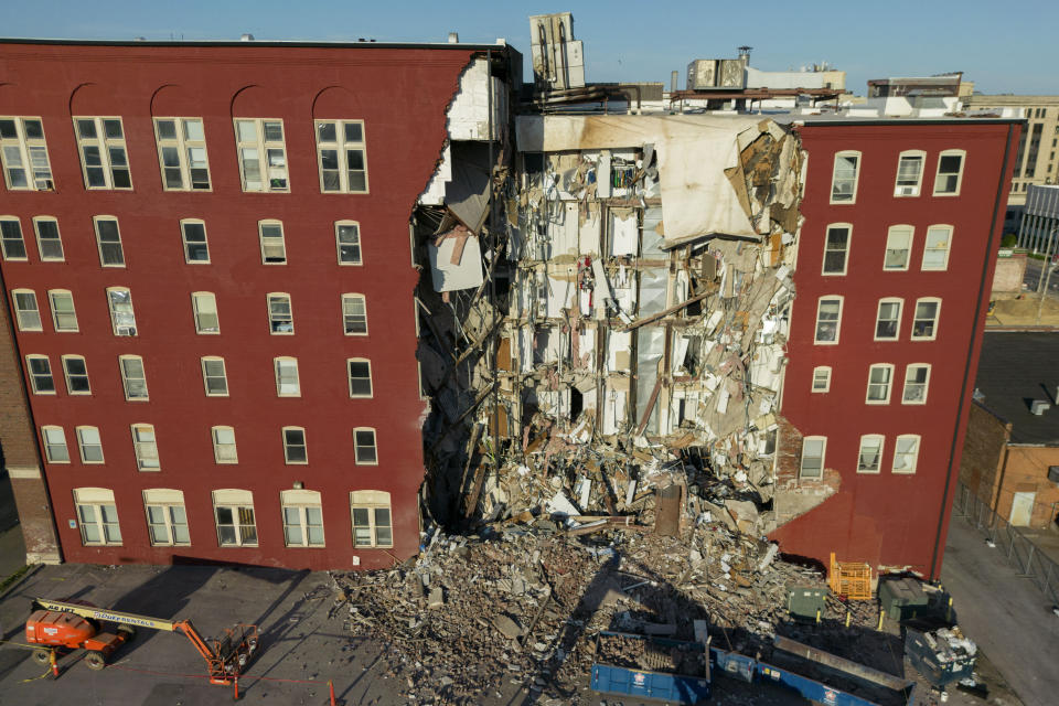 An apartment building that partially collapsed two days earlier can be seen Tuesday, May 30, 2023, in Davenport, Iowa. Five residents of the six-story apartment building remained unaccounted for and authorities fear at least two of them might be stuck inside rubble that was too dangerous to search. (AP Photo/Erin Hooley)