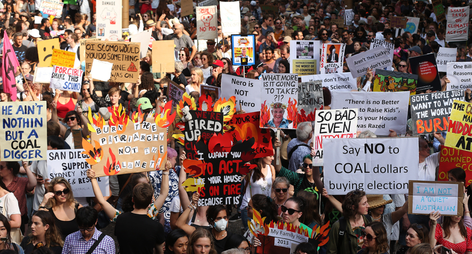 A sea of protesters and signs at a climate march in Sydney.