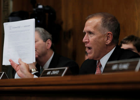 U.S. Senator Thom Tillis (R-NC) displays a judiciary committee document while questioning U.S. Supreme Court nominee Brett Kavanaugh during a Senate Judiciary Committee confirmation hearing on Capitol Hill in Washington, U.S., September 27, 2018. REUTERS/Jim Bourg