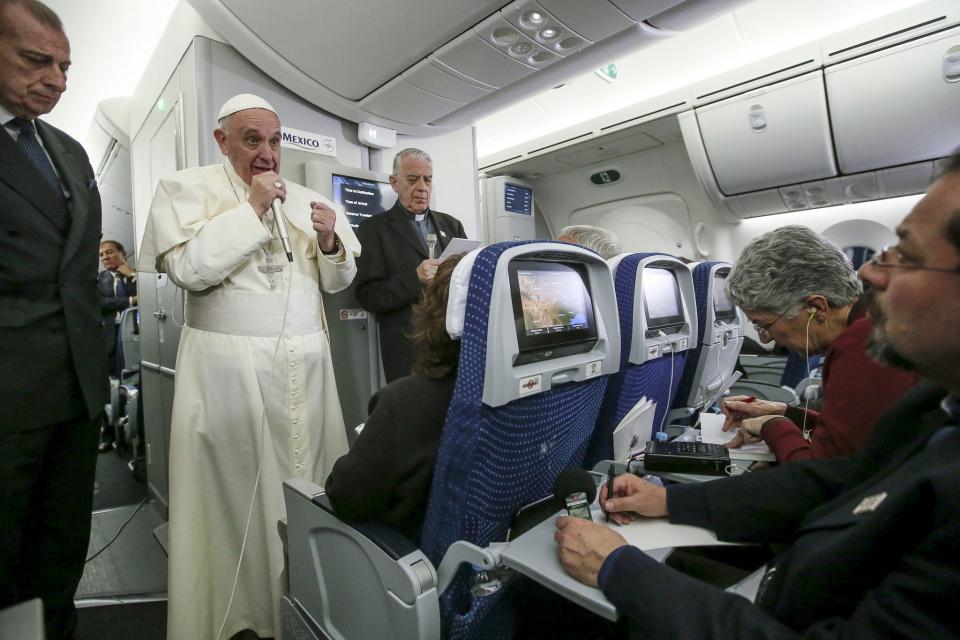 Pope Francis gestures during a meeting with the media onboard the papal plane while en route to Rome, Italy February 17, 2016. (Alessandro Di Meo/Pool/Reuters)