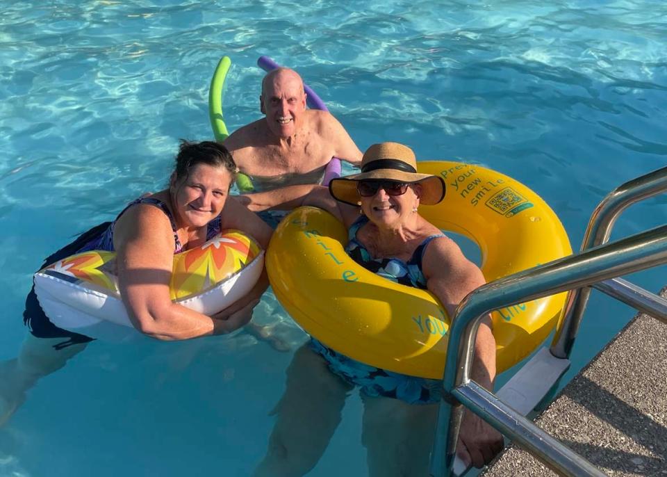 Suzanne Davidson with dad Glenn Jolliffe and mom Georgia Jolliff, who are visiting from Ohio, enjoy the cool water at the summer pool party hosted by Beaver Ridge United Methodist Church at the Karns Lions Club Community Pool Saturday, July 16, 2022.