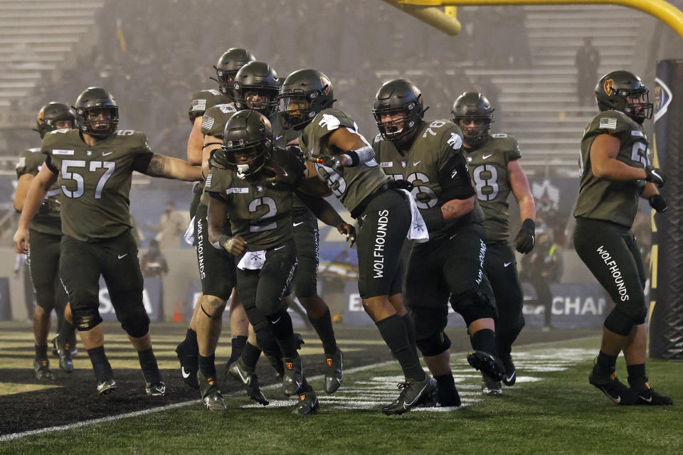 Army quarterback Tyhier Tyler celebrates after scoring a touchdown during the second half of an NCAA college football game Saturday, Dec. 12, 2020, in West Point, N.Y.  (AP Photo/Adam Hunger)