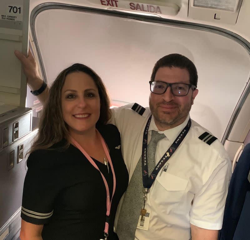 Jessica and Rene Trujillo pose after a United Airlines flight from San Francisco in Houston