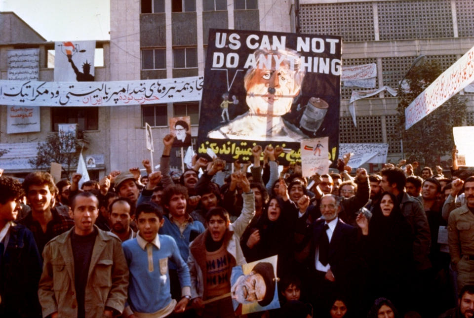 FILE - In this Nov. 8, 1979 file photo, protesters chant outside the U.S. Embassy in Tehran, Iran. Forty years ago on Nov. 4, 1979, Iranian students overran guards to take over the U.S. Embassy in Tehran, starting a 444-day hostage crisis that transfixed America. (AP Photo, File)