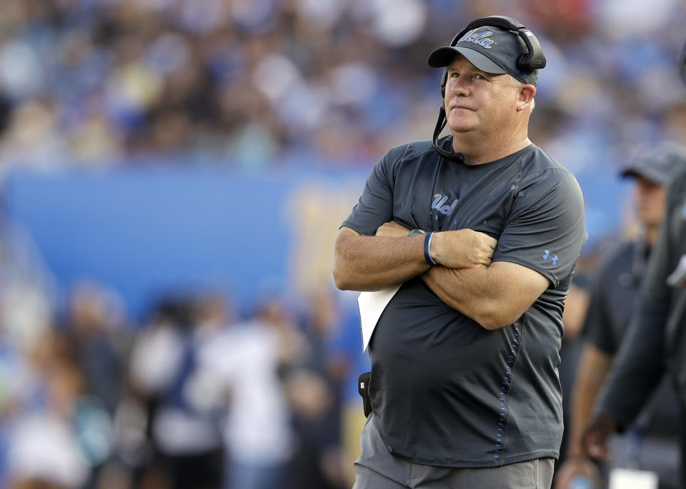 Chip Kelly didn’t like the way his team was playing on the field, so he called for running practice drills on the sideline. (AP Photo)