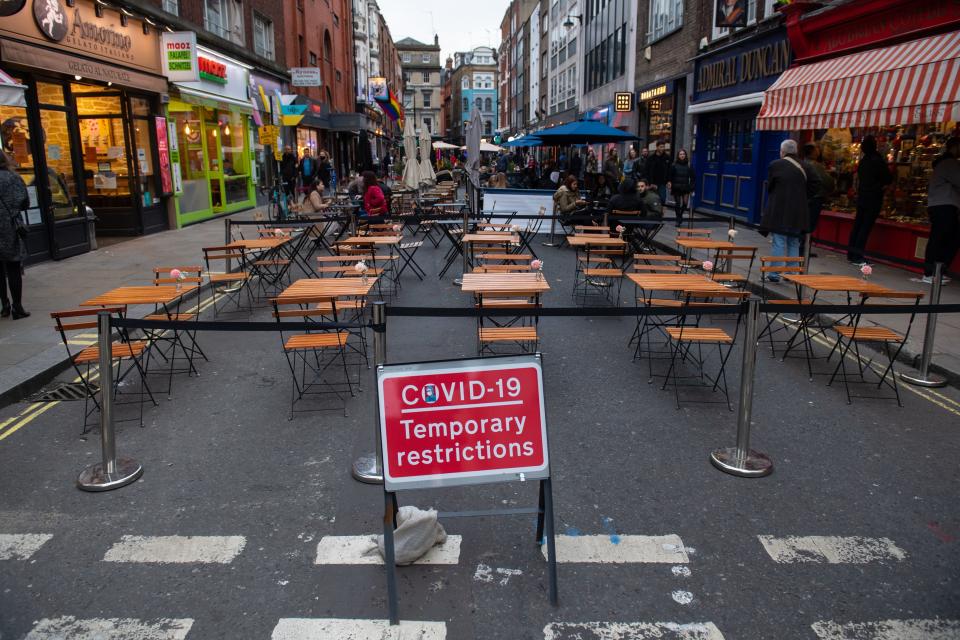 Covid 19 signage in Soho, London, on the first day after the city was put into Tier 2 restrictions to curb the spread of coronavirusPA