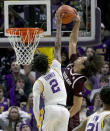 Texas A&M guard Marcus Williams (1) has his shot blocked by LSU guard Eric Gaines (2) during the second half of an NCAA college basketball game in Baton Rouge, La., Wednesday, Jan. 26, 2022. (AP Photo/Matthew Hinton)