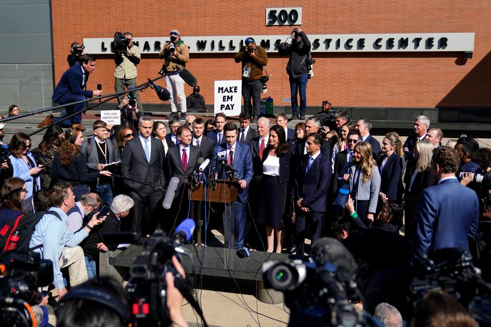 Attorneys for Dominion Voting Systems speak at a news conference outside New Castle County Courthouse in Wilmington, Del., after the defamation lawsuit by Dominion Voting Systems against Fox News was settled just as the jury trial was set to begin, Tuesday, April 18, 2023.
