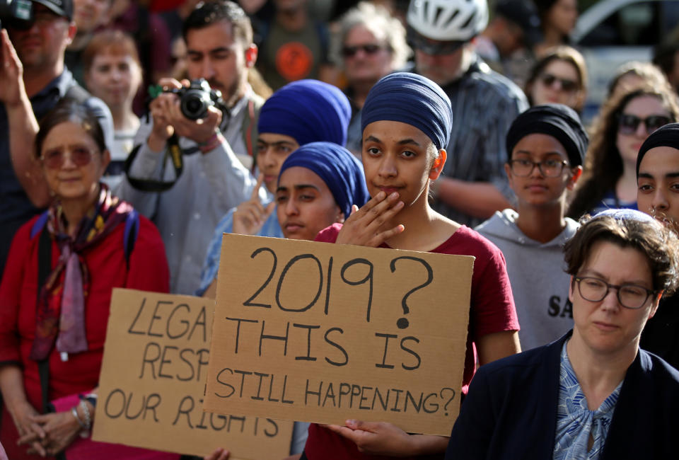 People protest Quebec's new Bill 21, which will ban teachers, police, government lawyers and others in positions of authority from wearing religious symbols such as Muslim head coverings and Sikh turbans, in Montreal on June 17. (Photo: Christinne Muschi / Reuters)