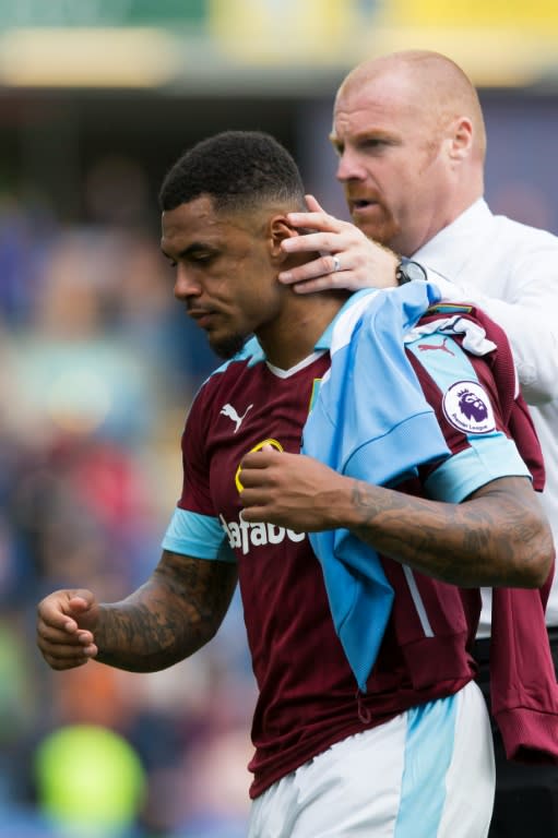 Burnley's striker Andre Gray is congratulated by team manager Sean Dyche after their English Premier League match against Liverpool, at Turf Moor in Burnley, on August 20, 2016