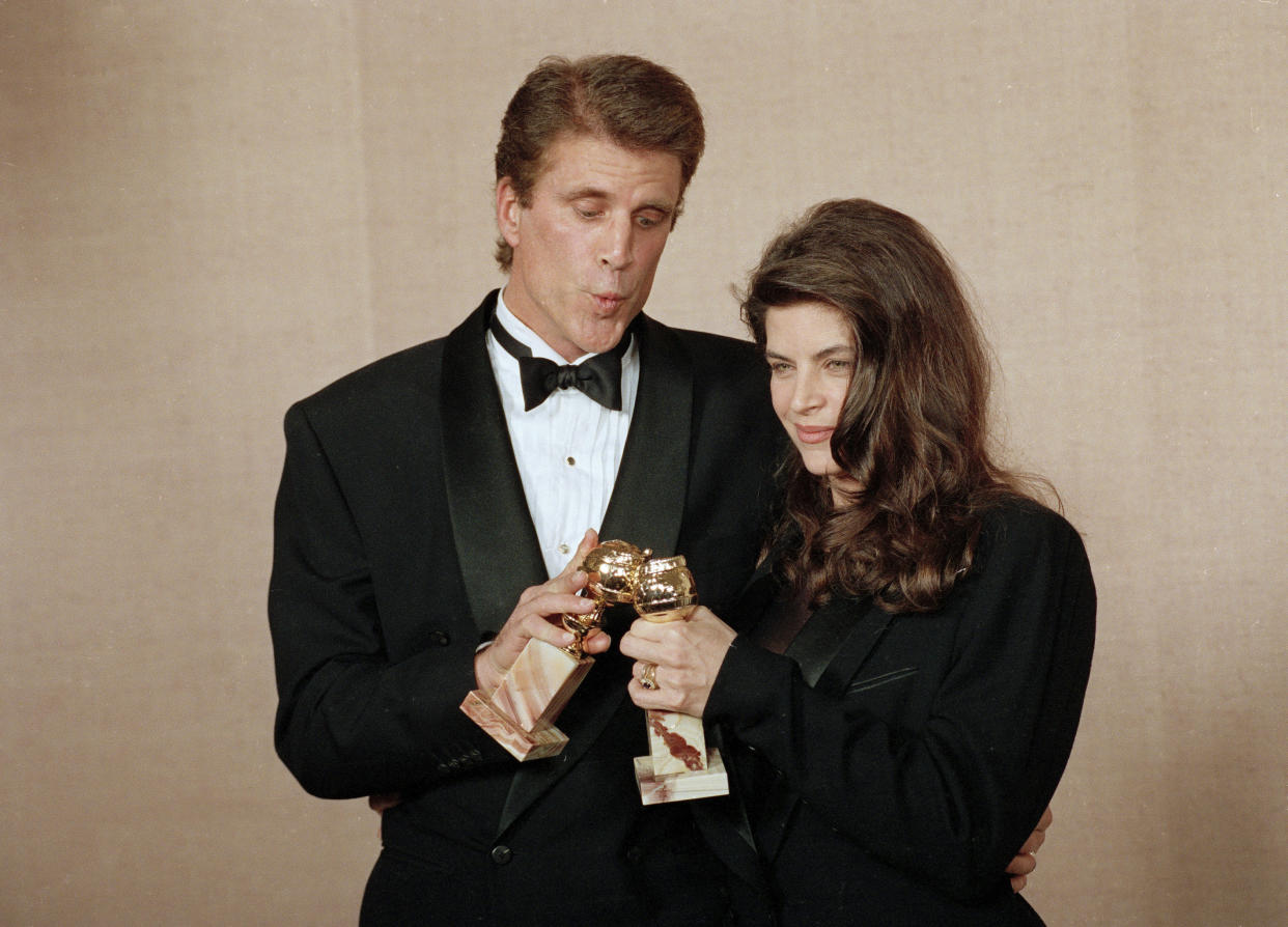 FILE - Ted Danson, left, and Kirstie Alley pose backstage at the 48th Annual Golden Globe Awards on Jan. 19, 1991, in Beverly Hills, Calif. Danson and Alley won for best actor and best actress in a television comedy for their work on "Cheers." Alley, a two-time Emmy winner who starred in the 1980s sitcom “Cheers” and the hit film “Look Who’s Talking,” has died. She was 71. Her death was announced Monday by her children on social media and confirmed by her manager. The post said their mother died of cancer that was recently diagnosed. (AP Photo/Doug Pizac, File)