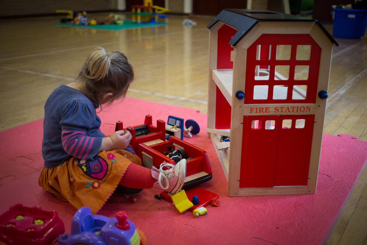 RADSTOCK, UNITED KINGDOM - JANUARY 06:  A young girl plays with toys at a playgroup for pre-school aged children in Chilcompton near Radstock on January 6, 2015 in Somerset, England. Along with the health and the economy, education and childcare are to be key issues in the forthcoming election.  (Photo by Matt Cardy/Getty Images)