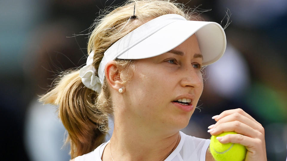 Daria Saville concentrates before serving at Wimbledon.