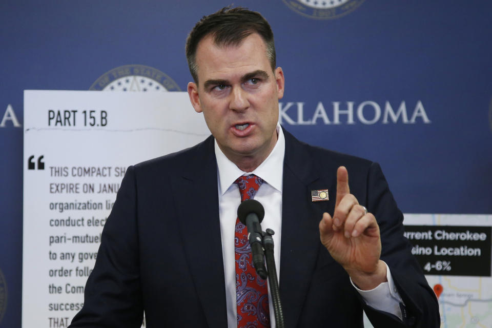 In this Dec. 17, 2019, file photo, Oklahoma Gov. Kevin Stitt gestures during a news conference in Oklahoma City. (AP Photo/Sue Ogrocki, File)