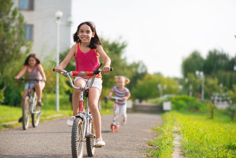 <span class="caption">Local parks help people come together and enjoy nature in their own neighbourhoods.</span> <span class="attribution"><a class="link " href="https://www.shutterstock.com/image-photo/three-happy-children-riding-on-bicycle-214352896?src=LEMrlJGuW87fOj9rVBD5rg-1-1" rel="nofollow noopener" target="_blank" data-ylk="slk:Spass/Shutterstock;elm:context_link;itc:0;sec:content-canvas">Spass/Shutterstock</a></span>