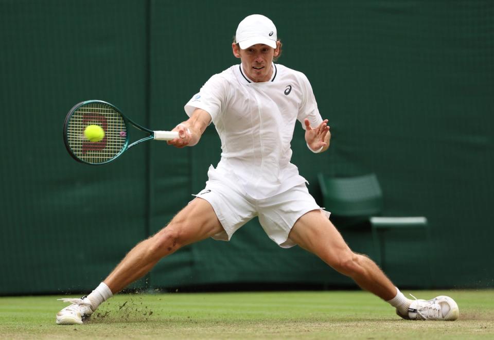 Alex de Minaur of Australia slides to play a forehand (Getty Images)