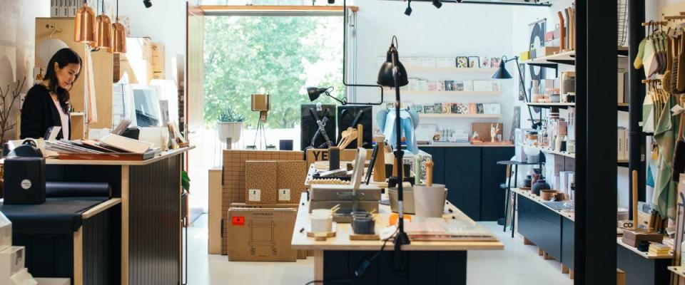 Woman working front desk at gift shop