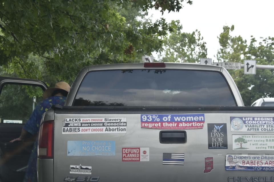 Carole Canfield gets into her truck July 27 after a morning spent protesting abortion at Bloomington's Planned Parenthood clinic, which she's done nearly every Thursday for 24 years. With the state's near-total-abortion ban set to go into effect Aug. 1, abortions will no longer be performed at the clinic and the Bloomington woman's protest days there may be over.