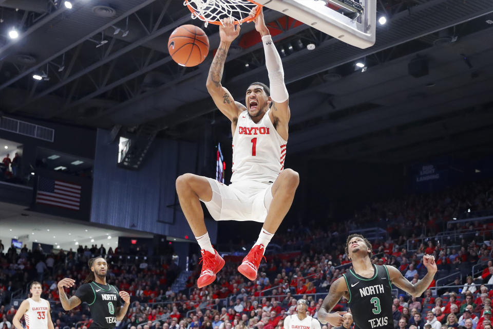 FILE - In this Dec. 17, 2019, file photo, Dayton's Obi Toppin (1) dunks as North Texas' Javion Hamlet (3) looks on during the second half of an NCAA college basketball game, in Dayton, Ohio. Toppin was voted the AP men's college basketball player of the year, Tuesday, March 24, 2020. (AP Photo/John Minchillo, File)